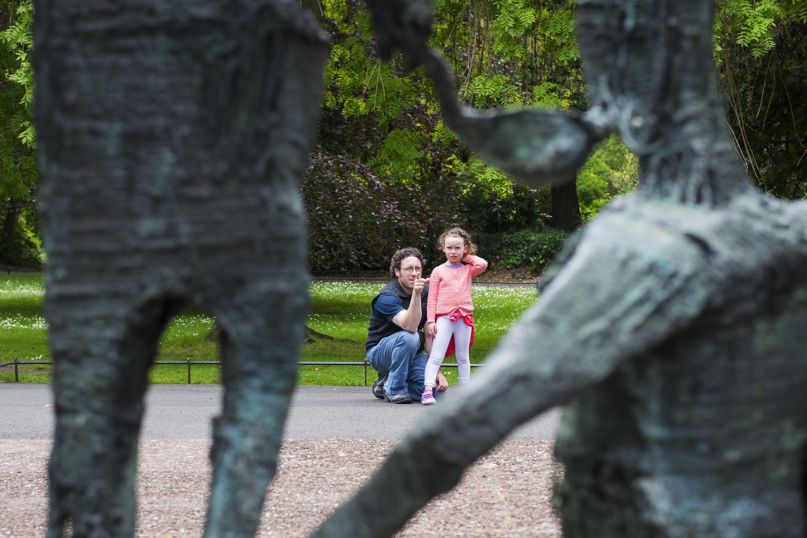 Image - A father explains the meaning of the Famine memorial in St Stephen's Green by Edward Delaney in St Stephen's Green, Dublin. Photo: Getty Images