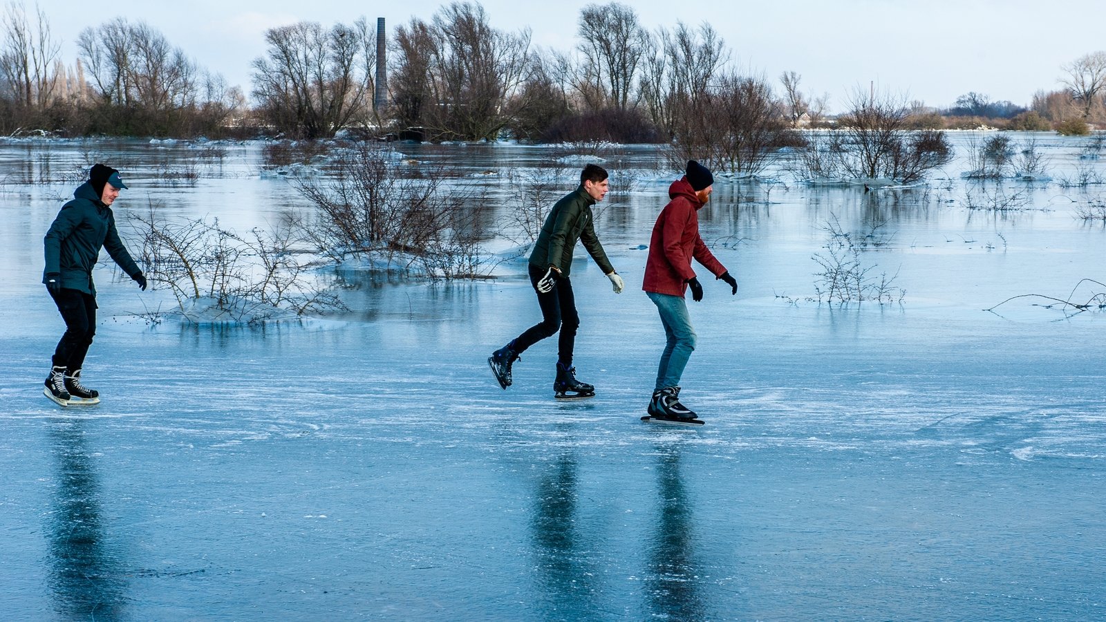 Dutch skate on frozen ponds in escape from lockdown