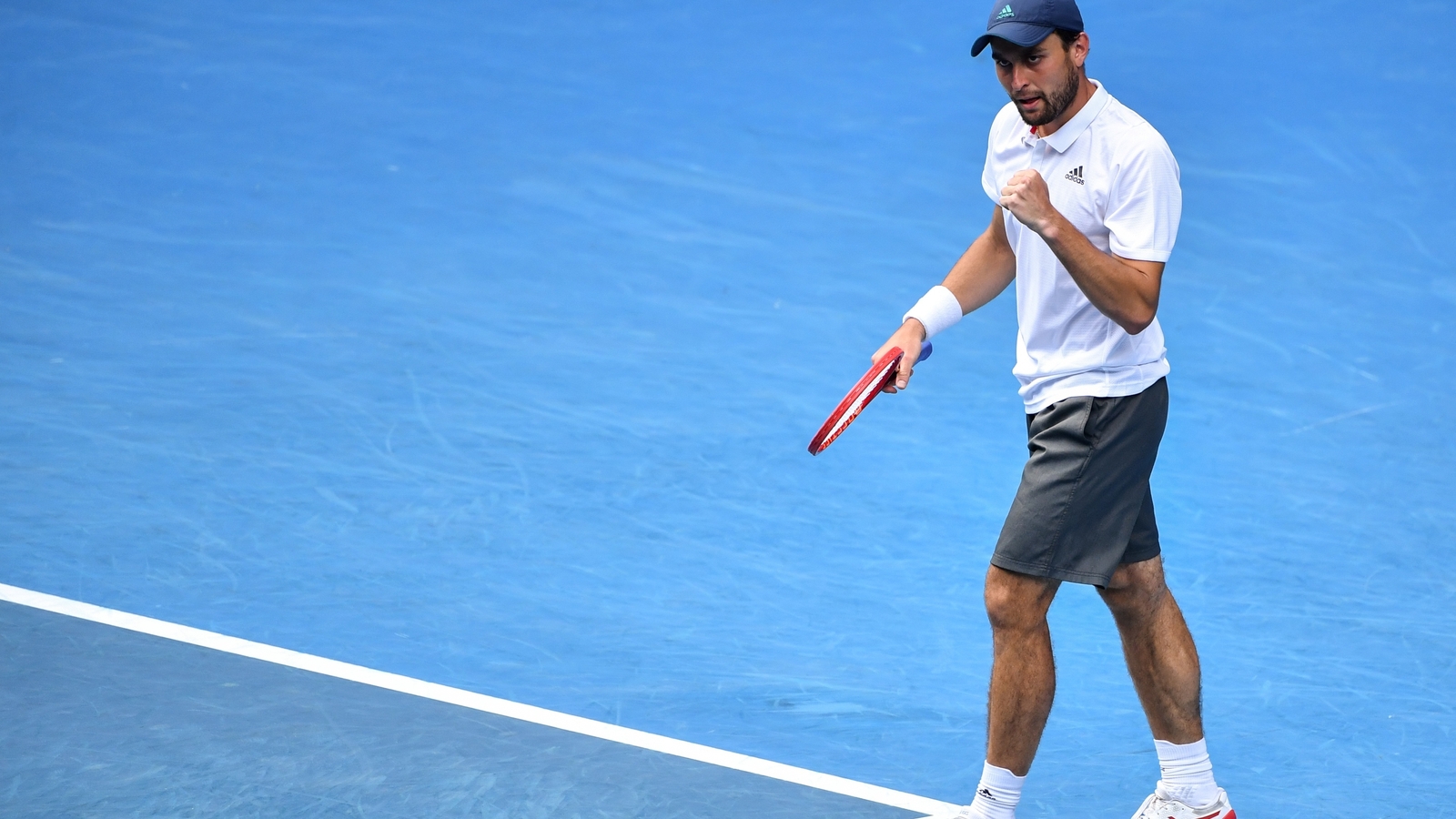 Djokovic battles past Zverev to face qualifier Karatsev