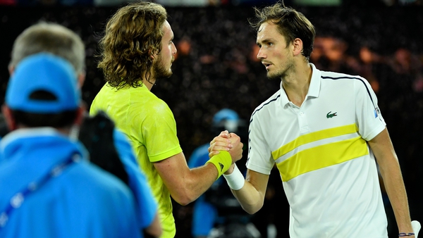 Daniil Medvedev (R) and Stefanos Tsitsipas greet each other after the match