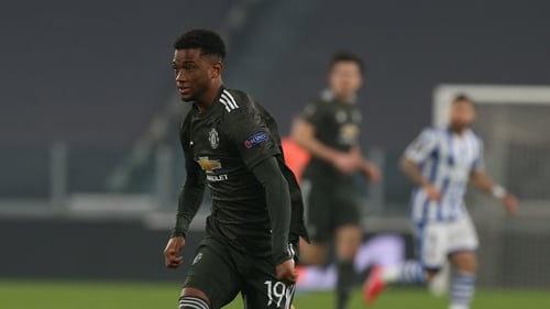 Amad Diallo in action against Real Sociedad on his debut with Harry Maguire watching on in the background