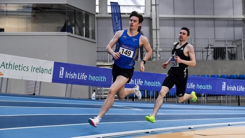 Cian McPhillips of Longford AC, left, leading Mark English out on the final lap of the Men's 800m