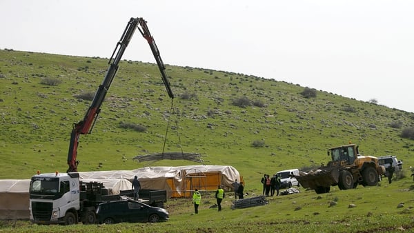 An Israeli bulldozer during demolition of a Bedouin encampment in the north of the occupied West Bank