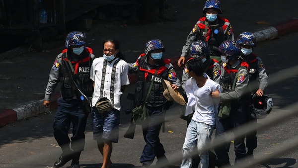 Police detain protesters in Yangon