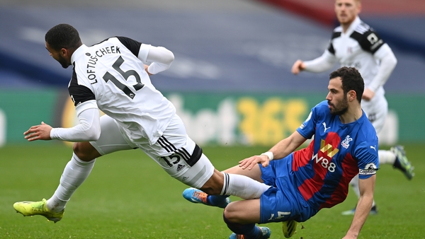 Fulham's uben Loftus-Cheek is fouled by Palace midfielder Luka Milivojevic