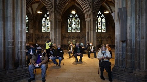 People receive their Covid-19 jab at a vaccine centre, Lichfield Cathedral, in Staffordshire, England