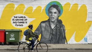A large mural of Greta Thunberg spans the side of a building in Dublin City centre.