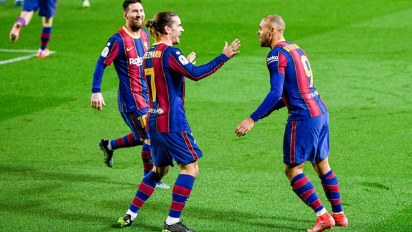 Lionel Messi and Antoine Griezmann race to congratulate Martin Braithwaite as the Denmark international scores Barcelona's third goal against Sevilla