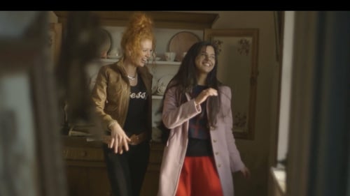 A scene from Town of Strangers: Chloe and her friend trying out dance moves