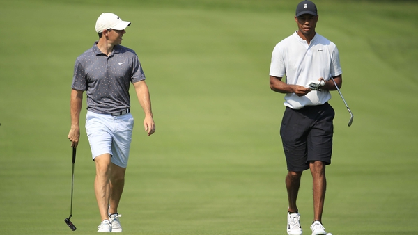Rory McIlroy and Tiger Woods playing a practice round last August