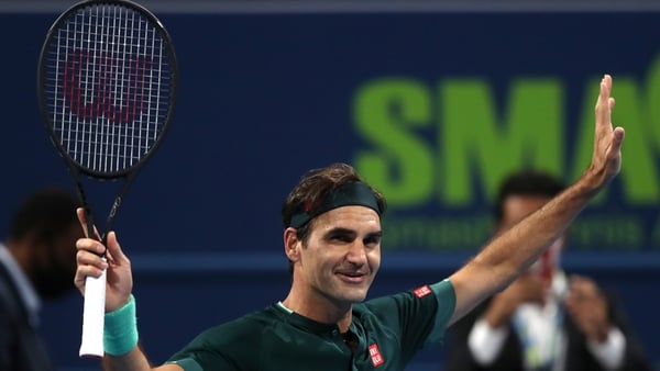 Roger Federer celebrates after beating Dan Evans