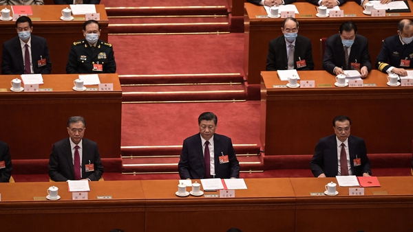 Politburo Standing Committee member Wang Yang (L), President Xi Jinping (C) and Premier Li Keqiang attend the closing session of the National People's Congress