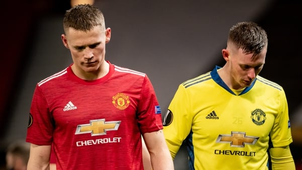 Scott McTominay and Dean Henderson react to Milan's late equaliser