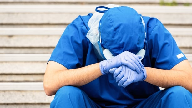 Upset health care worker wearing PPE