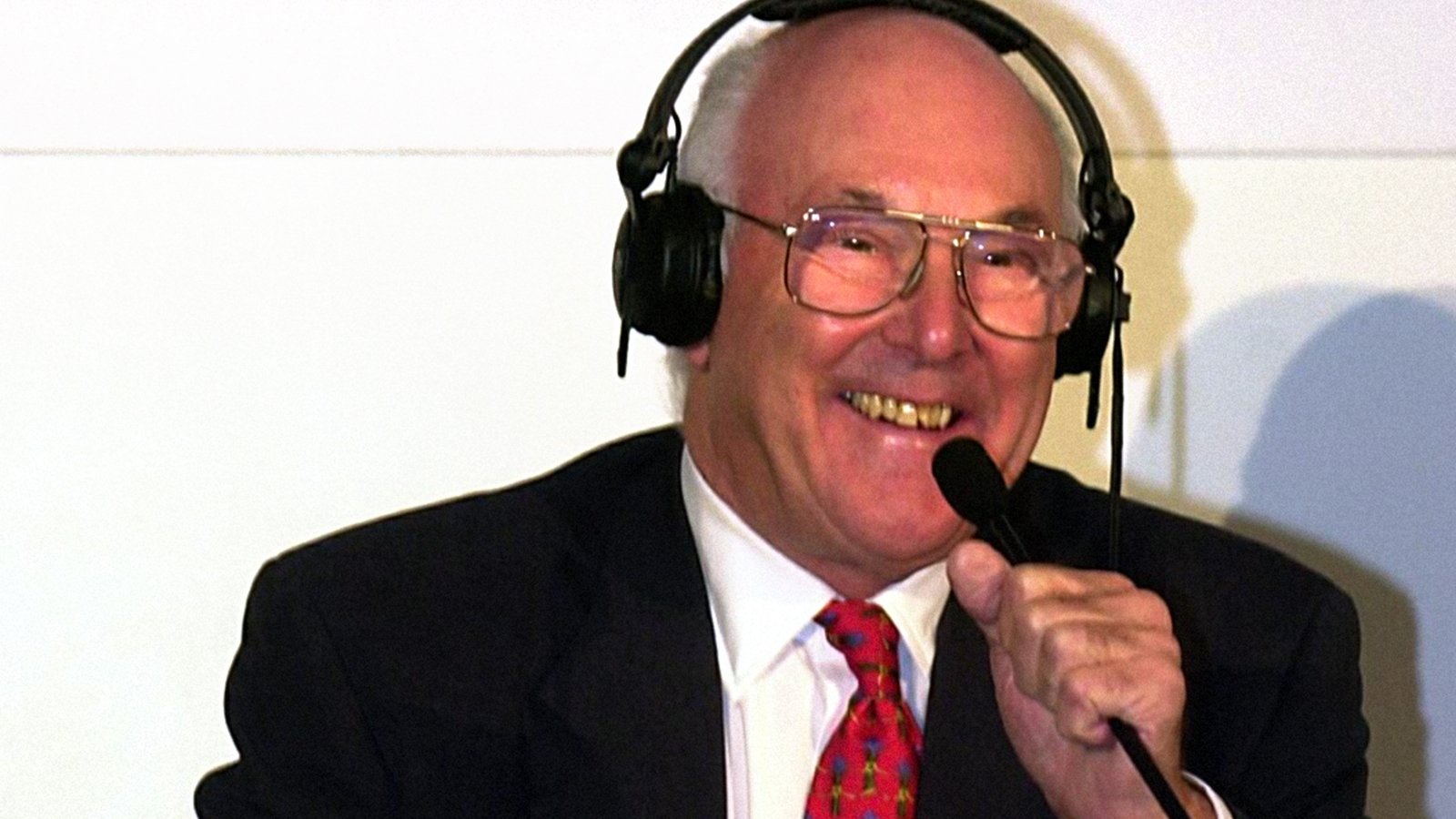 Murray Walker, voice of Formula One, dies aged 97