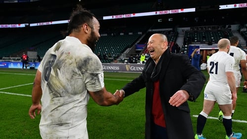 Eddie Jones celebrates with Billy Vunipola after England's win over France