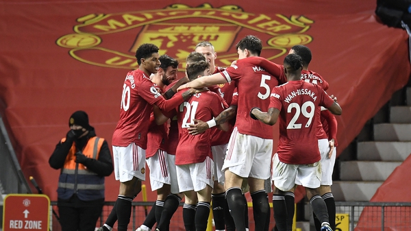 United players celebrate the only goal of the game at Old Trafford