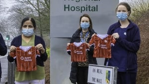 The tiny Sligo Rovers jerseys are held by some of Sligo hospital's dedicated nursing staff