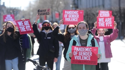 Protesters held placards saying 'pandemic of gender violence' and 'end victim blaming'