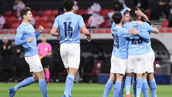 Man City players celebrate with goal scorer Kevin De Bruyne
