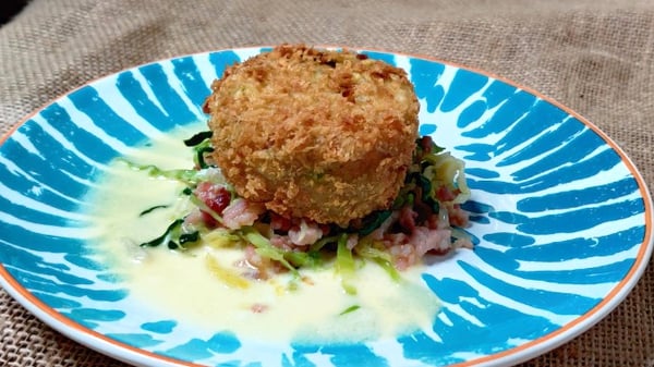Mags Roche's colcannon potato cake with buttered cabbage and smoked bacon cream sauce.