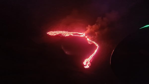 Streams of red lava could be seen flowing out of a fissure in the ground