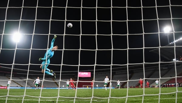 Mark Travers can only watch Aleksandar Mitrovic's lob sail into the net to make it t2-1 to Serbia on the night