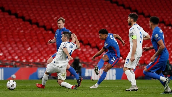 England's striker Ollie Watkins (C) scores their fifth goal