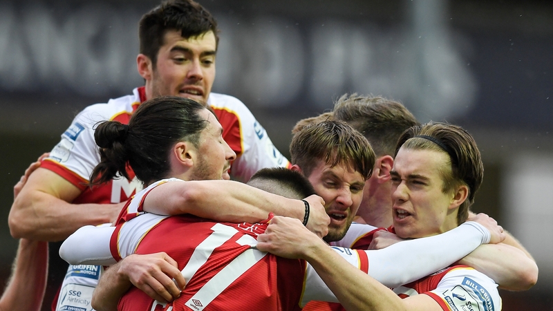 St Patrick's Athletic players mob Billy King after his winner