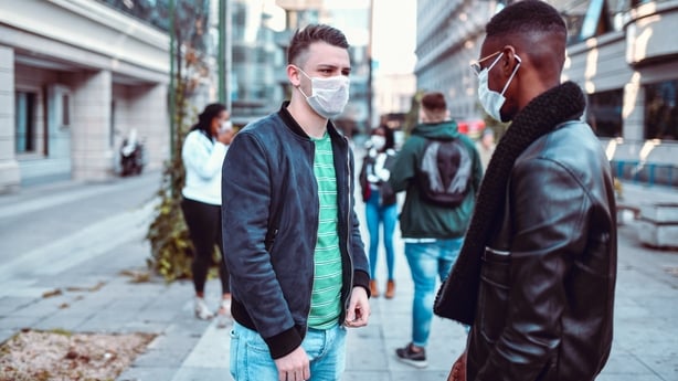 friends meeting outdoor wearing masks