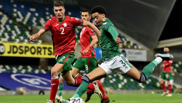 Jamal Lewis of Northern Ireland is challenged by Petko Hristov