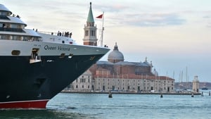The cruise ship 'Queen Victoria' passes close to St Mark's Square in Venice in September 2013