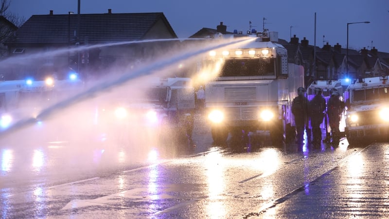 PSNI use a water cannon on the Springfield Road, during further unrest in Belfast