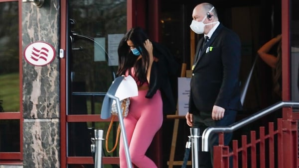 One of the two women leaves the Crowne Plaza Hotel in Santry this evening