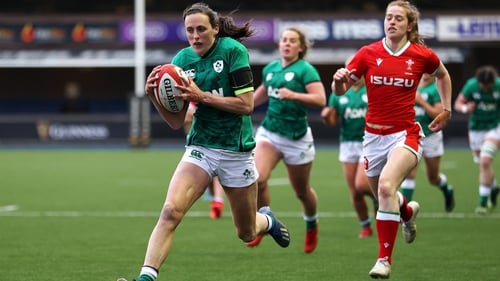 Hannah Tyrrell runs in a try against Wales