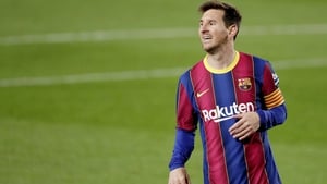 Lionel Messi scored twice as Barcelona remain in the hunt for the league title