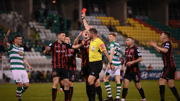 James Finnerty receives a red card from referee Paul McLaughlin