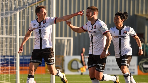 David McMillan celebrates with Patrick McEleney and Han Jeongwoo after scoring his side's first goal