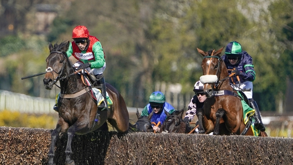 Harry Skelton riding Enrilo (left) clear the last to win the bet365 Gold Cup Handicap Chase only to lose it later in the stewards room