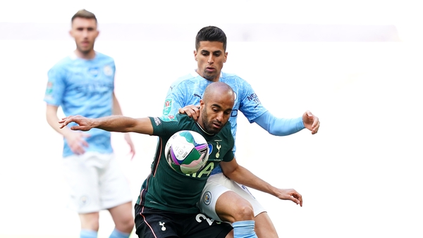 Lucas Moura battles for possession with Joao Cancelo