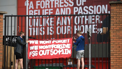 Supporters protest against Liverpool's US owner John Henry and FSG outside Anfield