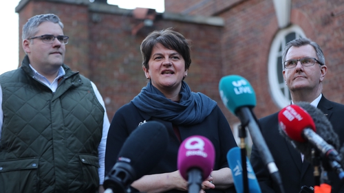 Arlene Foster pictured with Gavin Robinson (L) and Jeffrey Donaldson, two of those thought to be in the running to replace her