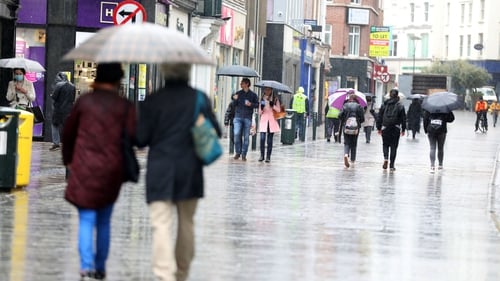 People on Dublin's Grafon Street shopping for hot water bottles, warmer duvets and bigger umbrellas