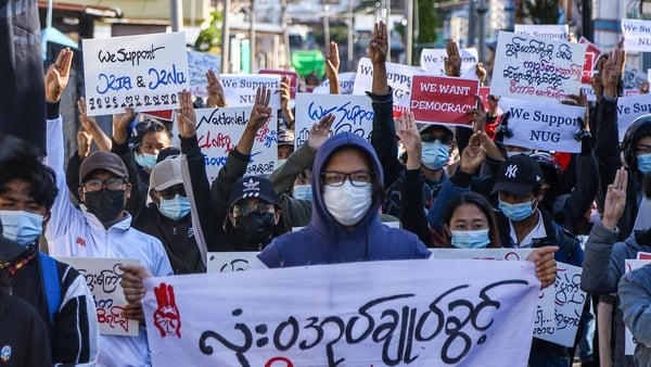 Protesters make the three-finger salute during a demonstration against the military coup on Global Myanmar Spring Revolution Day in Taunggyi, Shan state