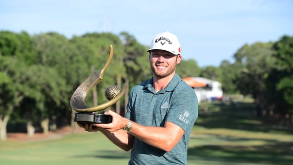 Sam Burns with his first PGA Tour trophy