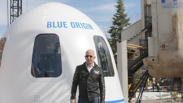 The bidder will join Jeff Bezos, pictured, on the Blue Origin spaceflight