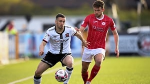 Michael Duffy of Dundalk in action against Lewis Banks of Sligo Rovers