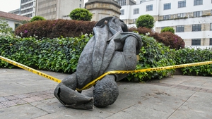 The statue of Spanish conquistador Gonzalo Jimenez de Quesada after being knocked down in Bogota today