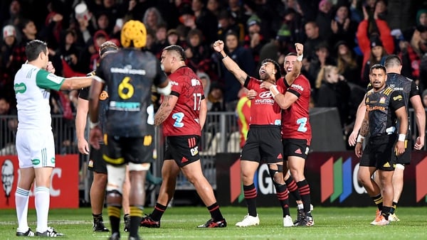 Richie Mo'unga celebrates at the full-time whistle with Crusaders team-mate Bryn Hall