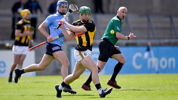 Martin Keoghan gets a shot away with Dublin's Seán Moran looking on